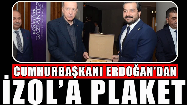 Cumhurbaşkanı Erdoğan’dan İzol’a plaket