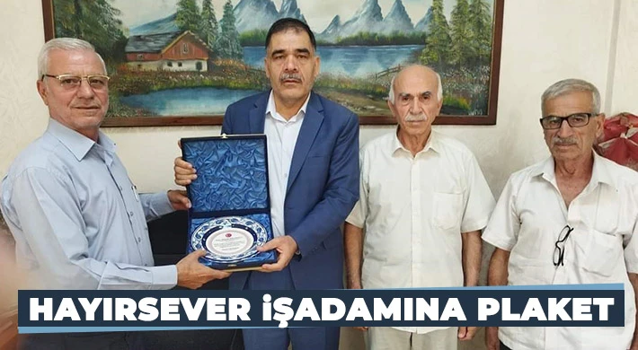 Hayırsever işadamına plaket