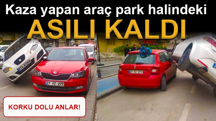 Kaza yapan araç park halindeki aracın üzerinde asılı kaldı