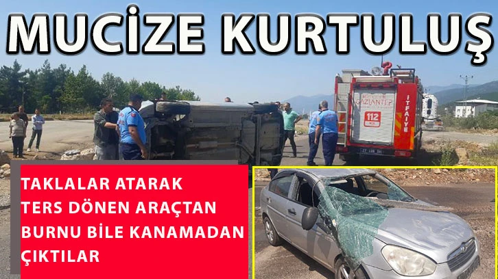 Taklalar atarak ters dönen araçtan burnu bile kanamadan çıktılar